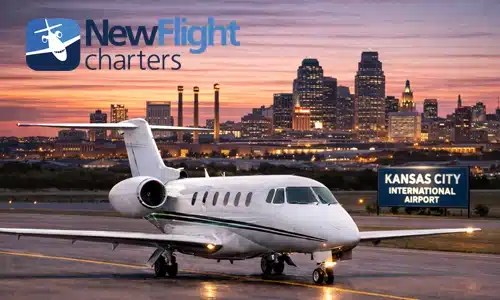 Private jet at Kansas City International Airport with downtown skyline during annual private jet travel planning